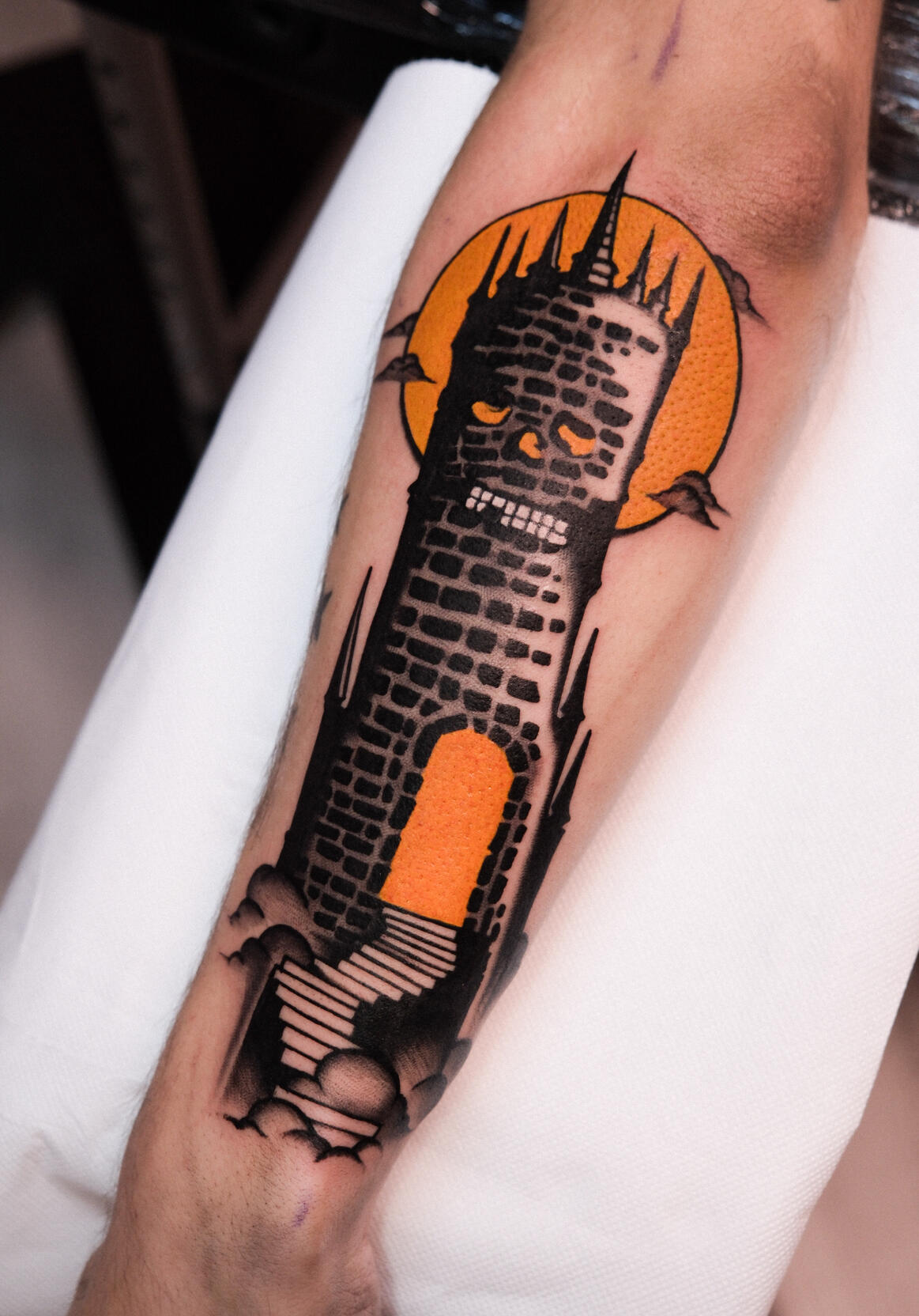Skull-tower with moon, traditional color tattoo done in Amsterdam